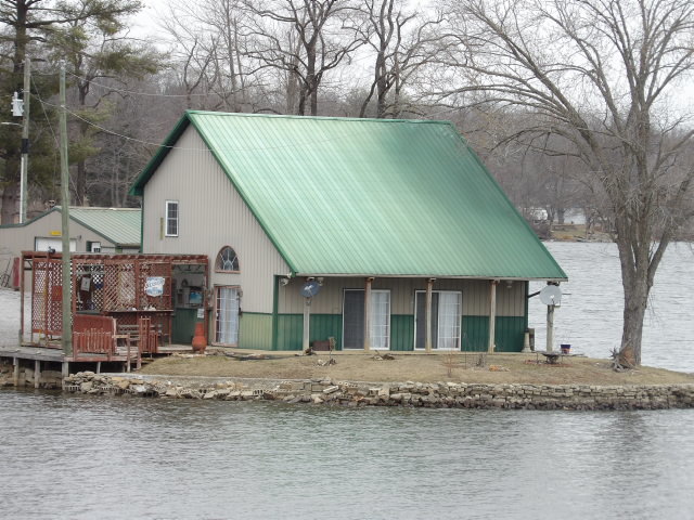 a house that has a tree in front of it