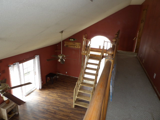 180 Morris Road Galatia, IL 62935 - Photo 12 of 28 a view of staircase and kitchen with wooden floor and white walls