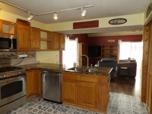 180 Morris Road Galatia, IL 62935 - Photo 14 of 28 a kitchen with kitchen island granite countertop a sink cabinets and stainless steel appliances
