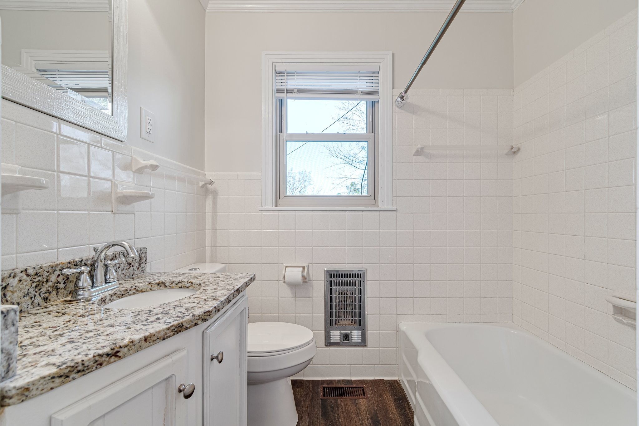 1002 Graymere Manor Road Columbia, TN 38401 - Photo 12 of 15 a bathroom with a granite countertop sink toilet and bathtub