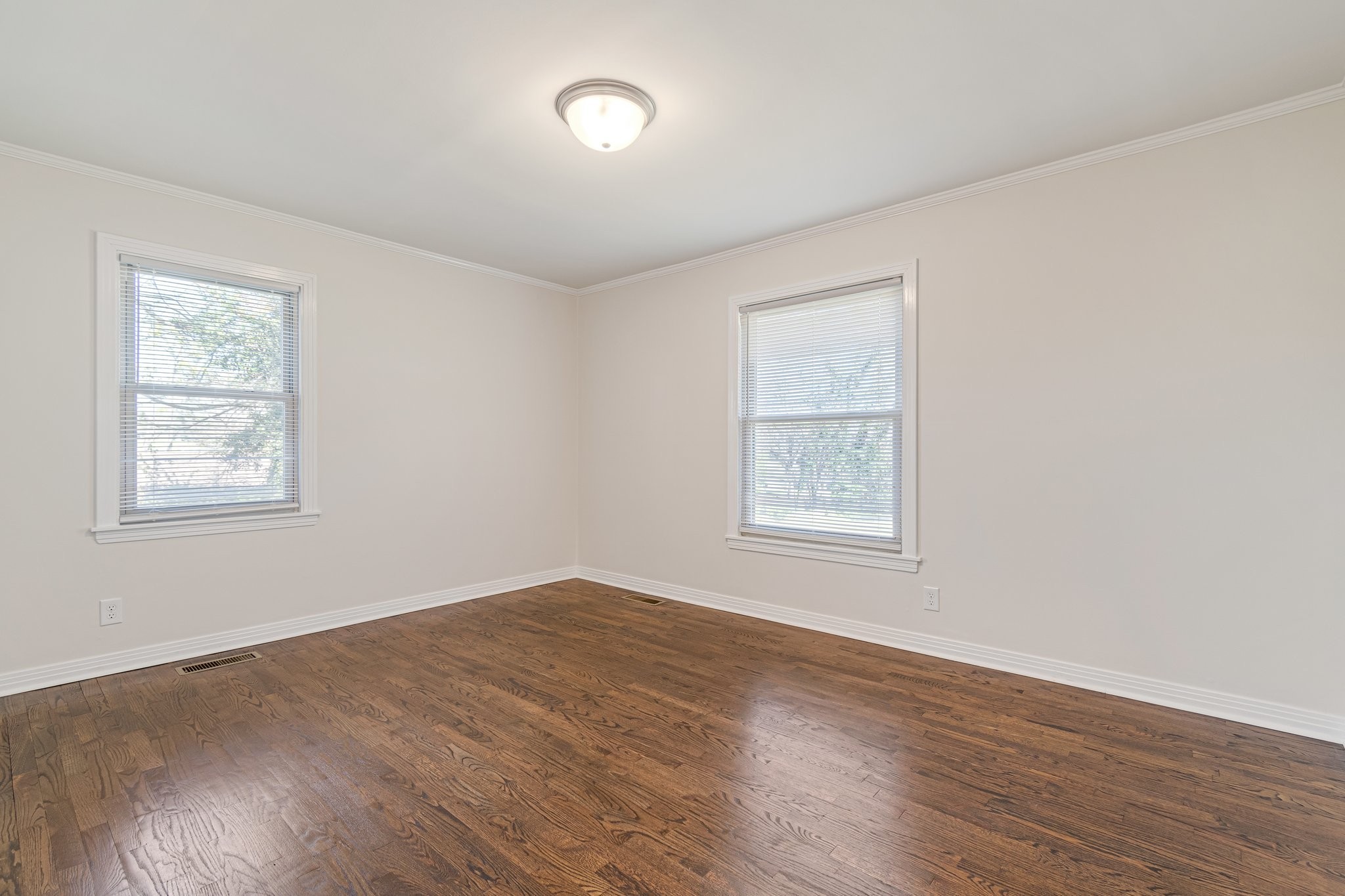 1002 Graymere Manor Road Columbia, TN 38401 - Photo 13 of 15 a view of an empty room with wooden floor and a window