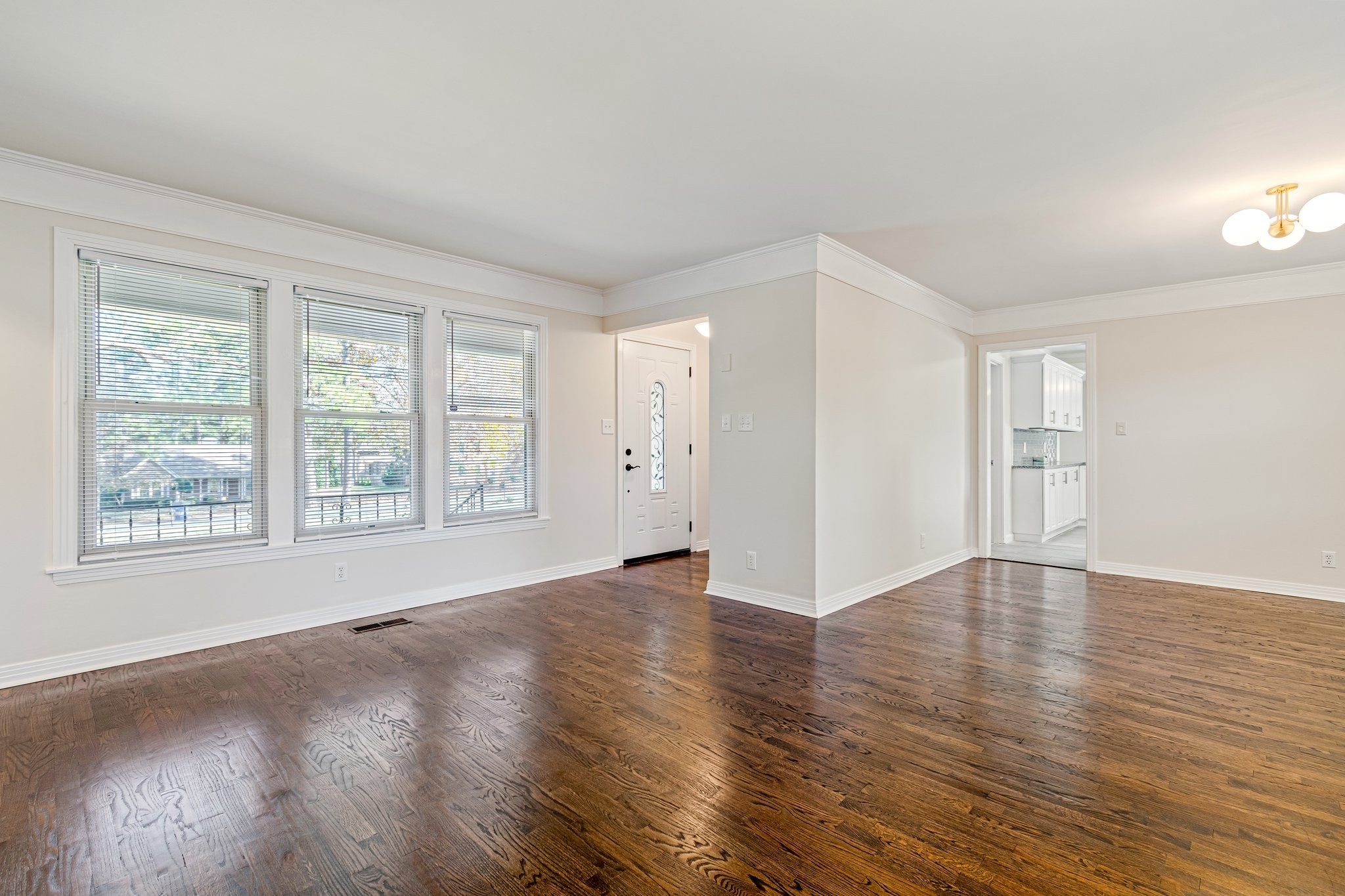 1002 Graymere Manor Road Columbia, TN 38401 - Photo 3 of 15 an empty room with wooden floor and windows
