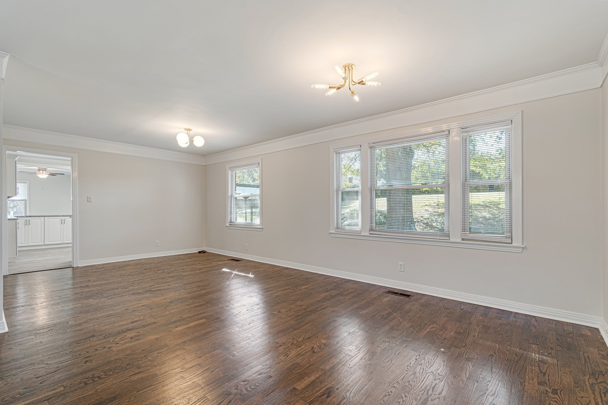 1002 Graymere Manor Road Columbia, TN 38401 - Photo 5 of 15 an empty room with wooden floor and windows