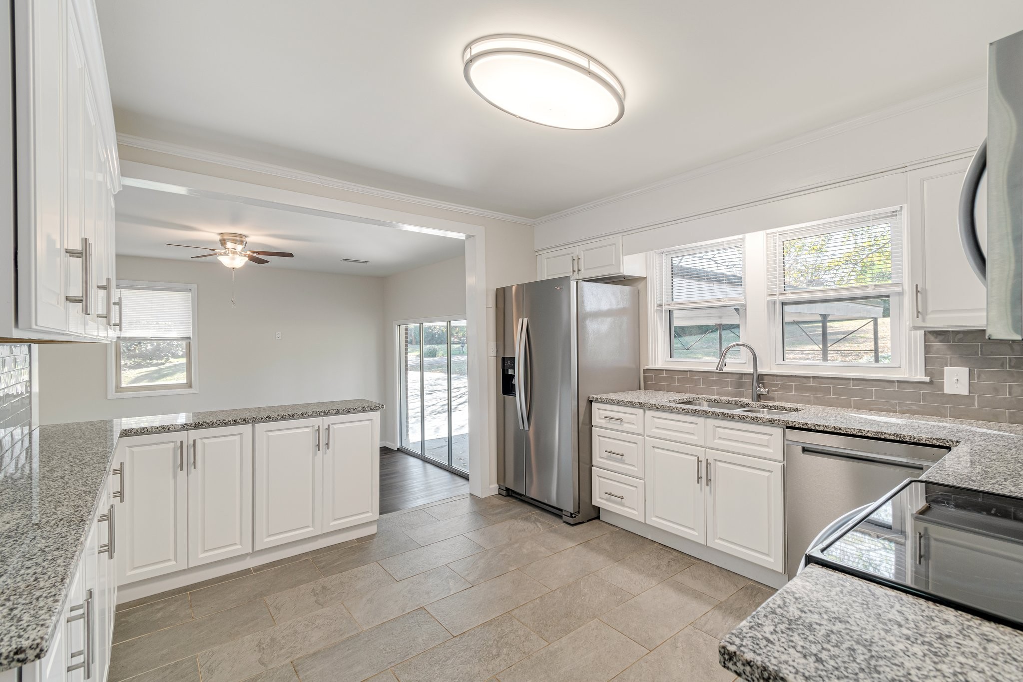 1002 Graymere Manor Road Columbia, TN 38401 - Photo 6 of 15 a large kitchen with stainless steel appliances granite countertop a sink and cabinets
