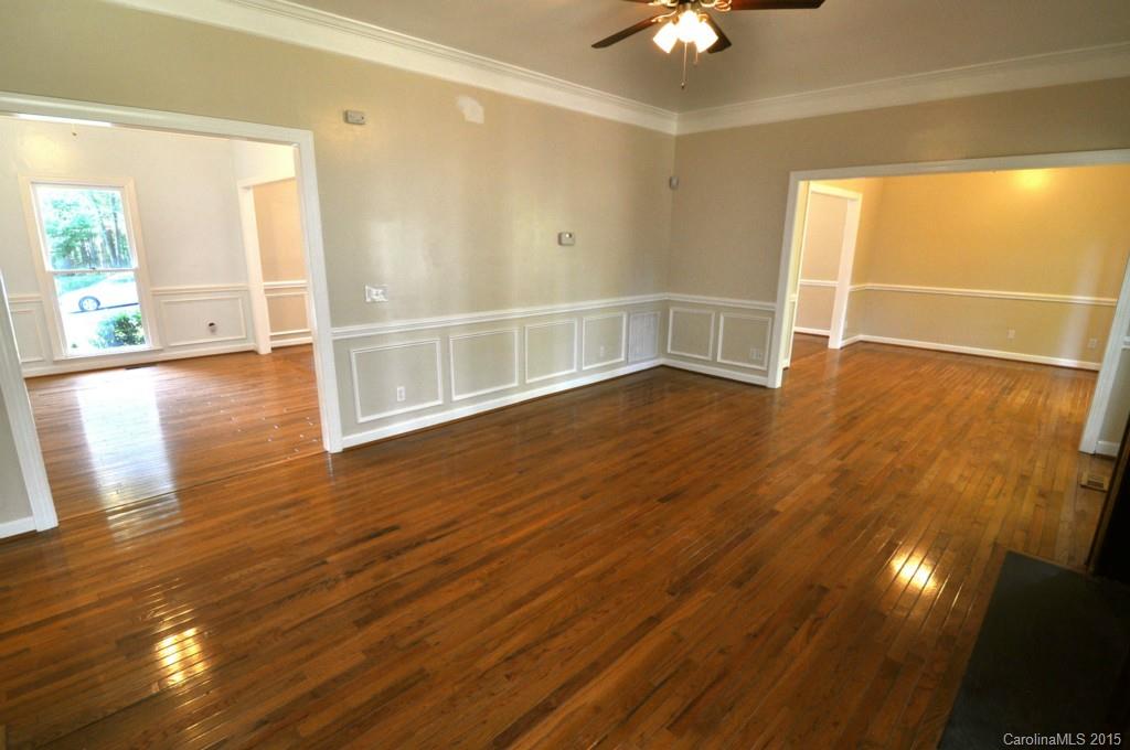 5015 Ridgetop Trail Charlotte, NC 28215 - Photo 11 of 24 wooden floor in an empty room with a window