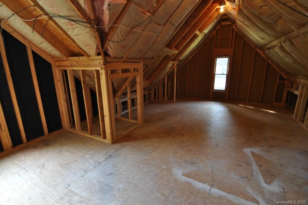 5015 Ridgetop Trail Charlotte, NC 28215 - Photo 22 of 24 a view of a hallway with wooden walls