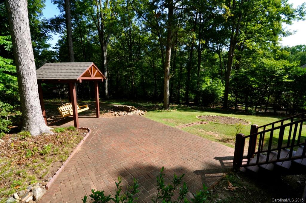 5015 Ridgetop Trail Charlotte, NC 28215 - Photo 23 of 24 a view of swimming pool with a patio and a backyard