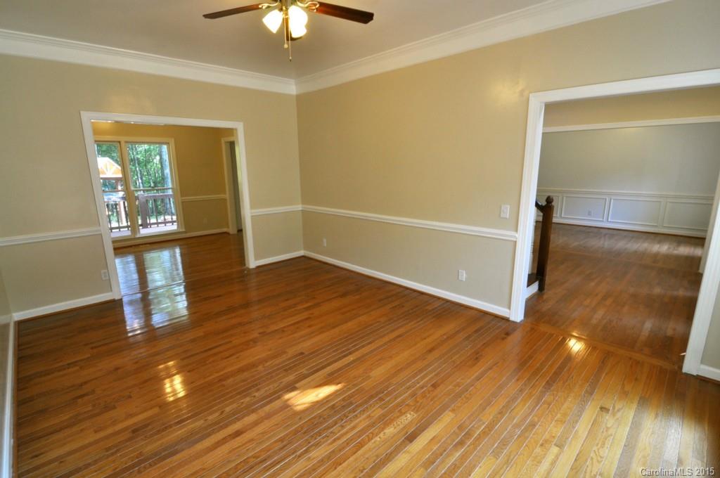 5015 Ridgetop Trail Charlotte, NC 28215 - Photo 6 of 24 wooden floor in an empty room with a window