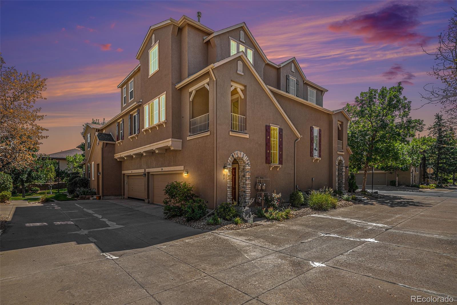 10515 Ashfield Street, Unit 1D Highlands Ranch, CO 80126 - Photo 1 of 39 a front view of a house with garden