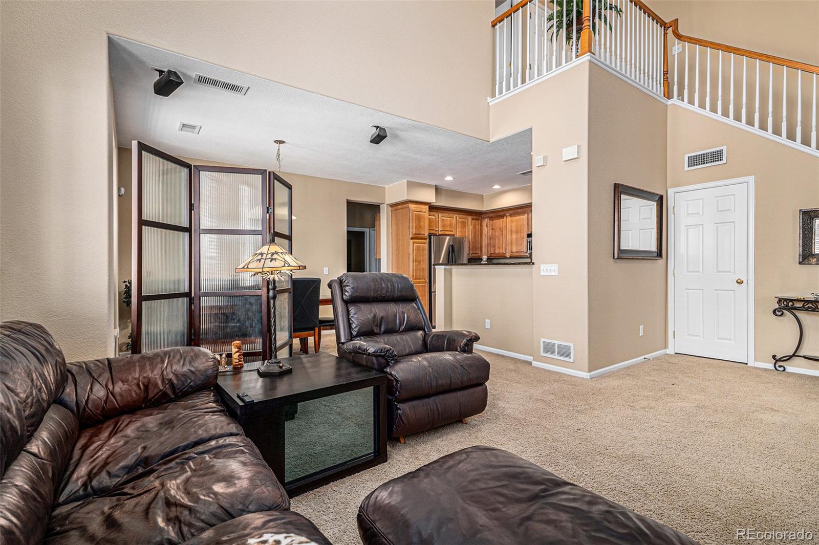 10515 Ashfield Street, Unit 1D Highlands Ranch, CO 80126 - Photo 13 of 39 a living room with furniture and a large window