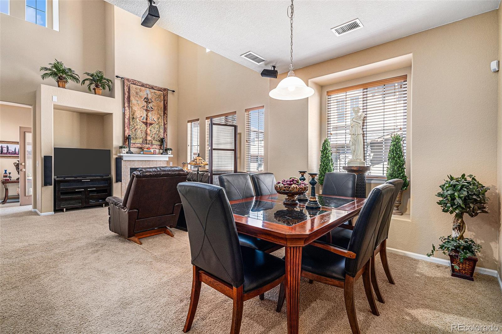 10515 Ashfield Street, Unit 1D Highlands Ranch, CO 80126 - Photo 14 of 39 a view of a dining room with furniture window and wooden floor