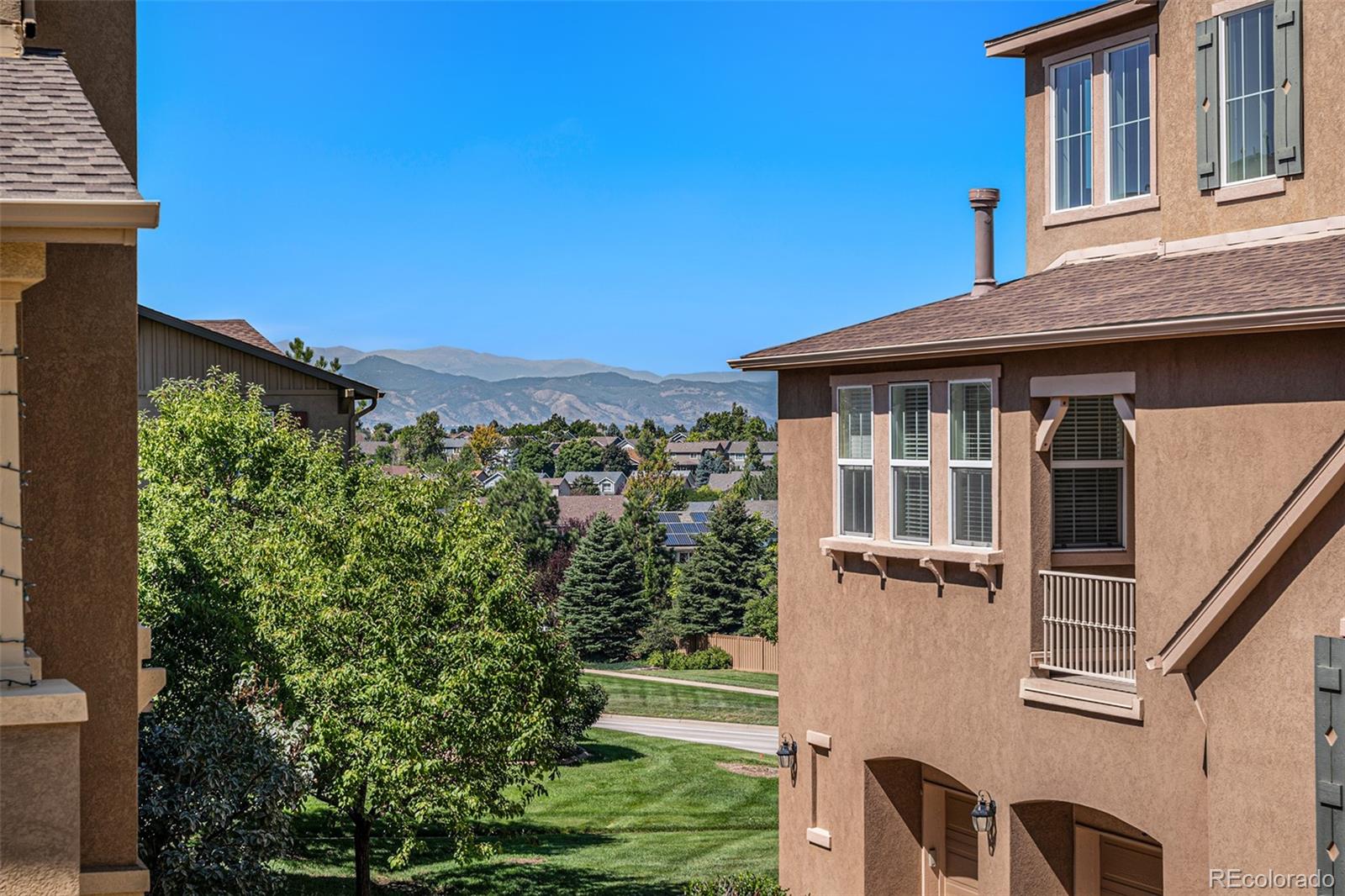10515 Ashfield Street, Unit 1D Highlands Ranch, CO 80126 - Photo 2 of 39 a view of a house with a yard and balcony