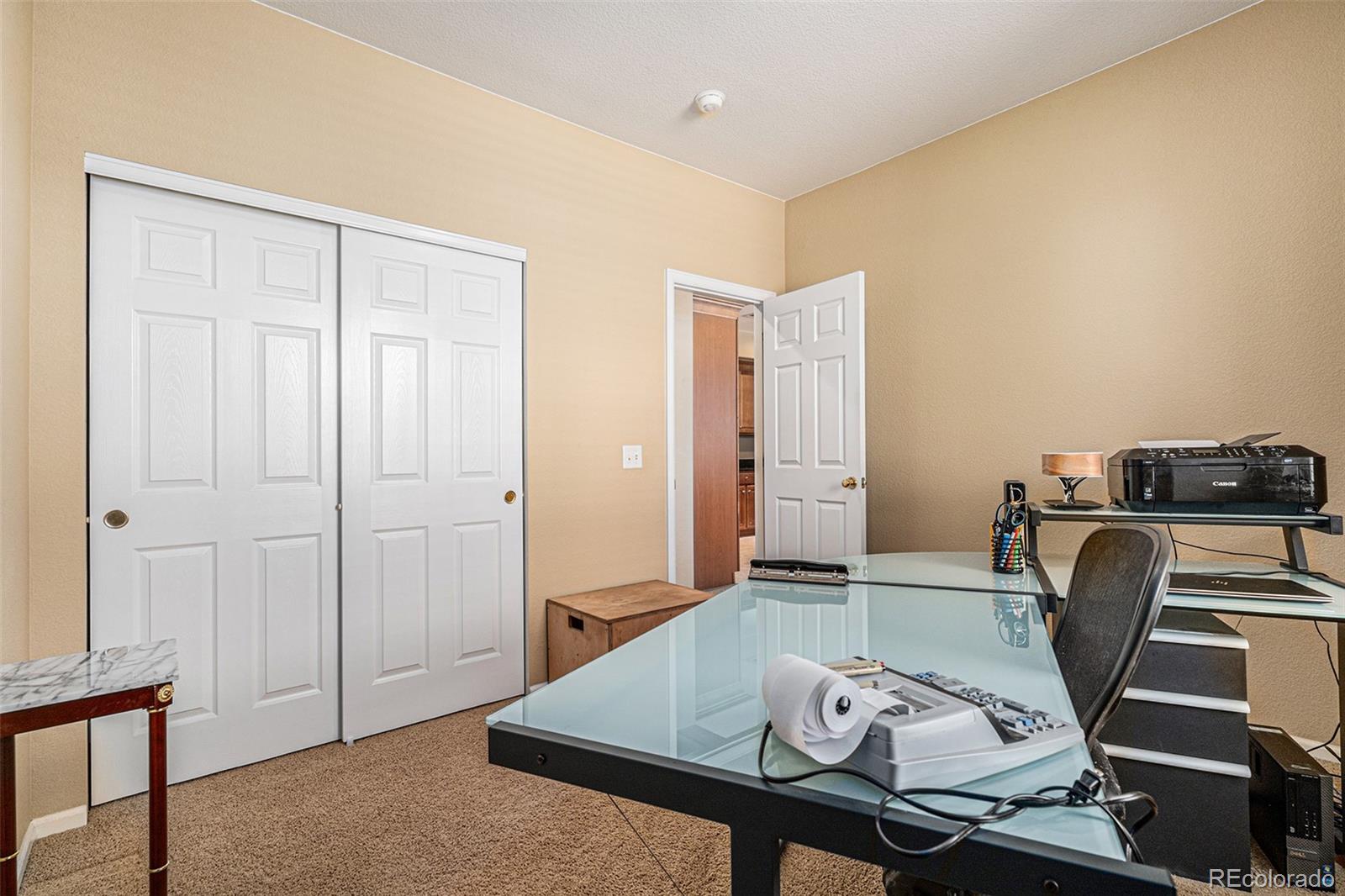 10515 Ashfield Street, Unit 1D Highlands Ranch, CO 80126 - Photo 23 of 39 a view of a workspace with furniture