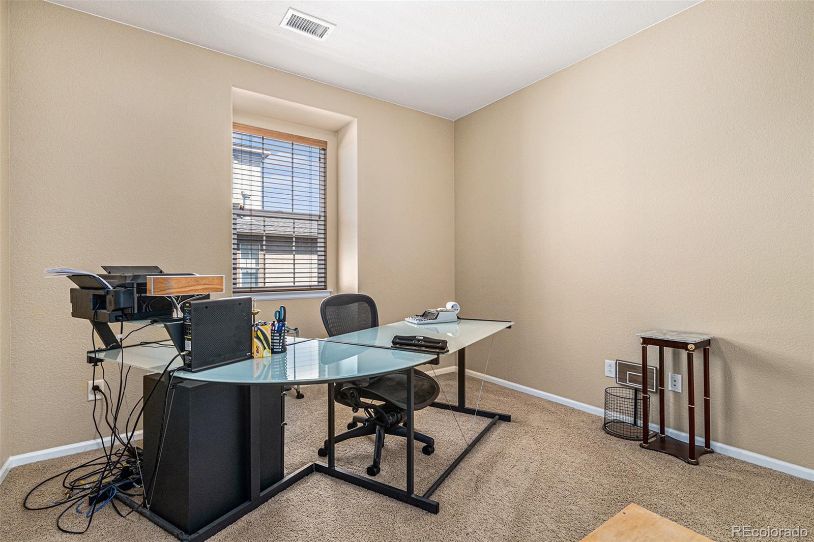 10515 Ashfield Street, Unit 1D Highlands Ranch, CO 80126 - Photo 24 of 39 a workspace with furniture and a window