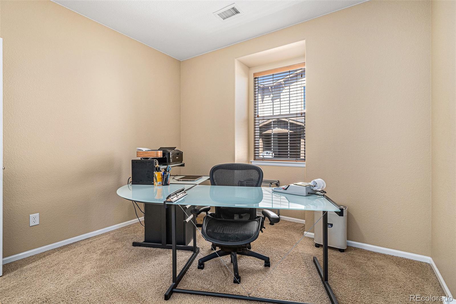 10515 Ashfield Street, Unit 1D Highlands Ranch, CO 80126 - Photo 25 of 39 a view of a workspace with furniture