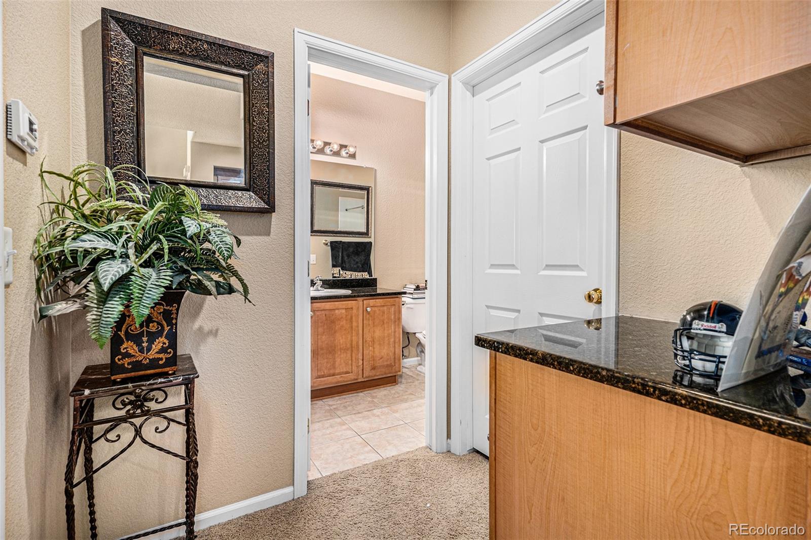 10515 Ashfield Street, Unit 1D Highlands Ranch, CO 80126 - Photo 26 of 39 a kitchen with a refrigerator and a sink