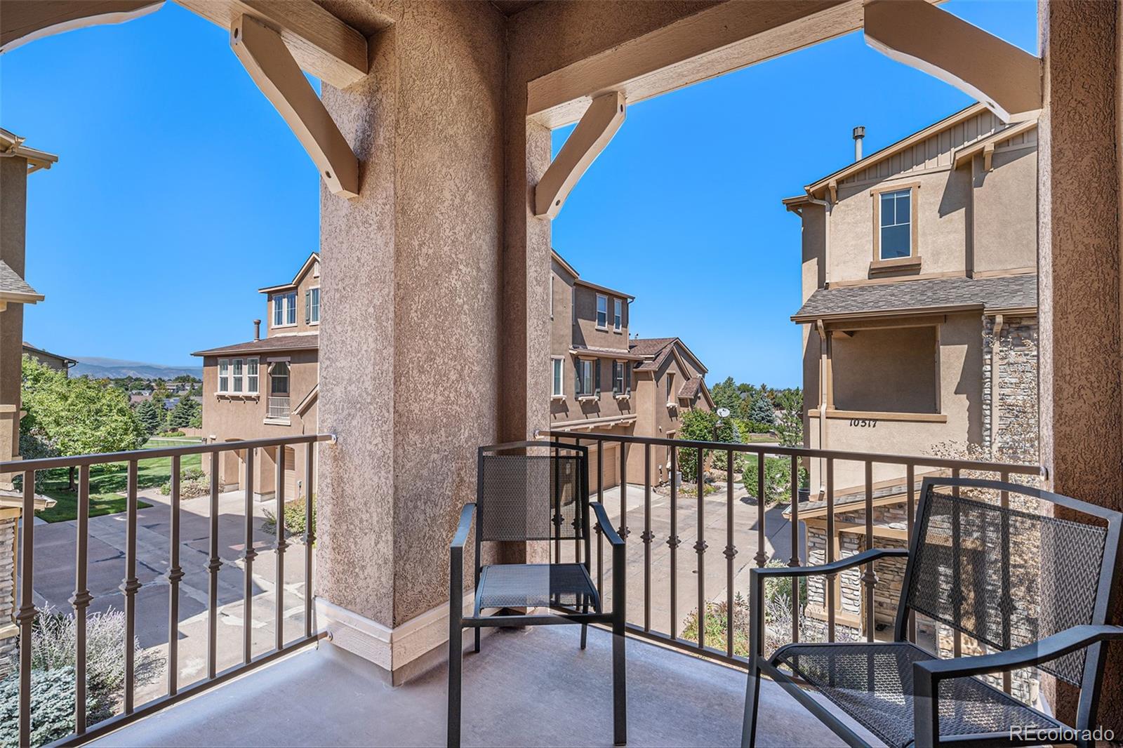 10515 Ashfield Street, Unit 1D Highlands Ranch, CO 80126 - Photo 3 of 39 a view of a building from a balcony