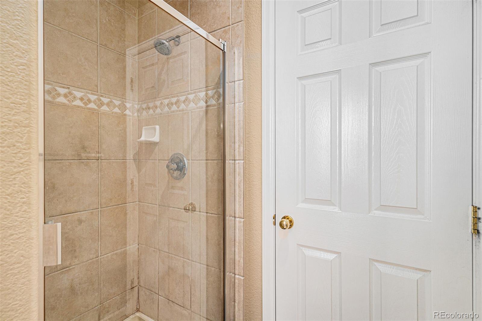 10515 Ashfield Street, Unit 1D Highlands Ranch, CO 80126 - Photo 33 of 39 a bathroom with a shower