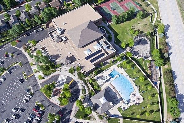 10515 Ashfield Street, Unit 1D Highlands Ranch, CO 80126 - Photo 37 of 39 an aerial view of a house with a yard and greenery