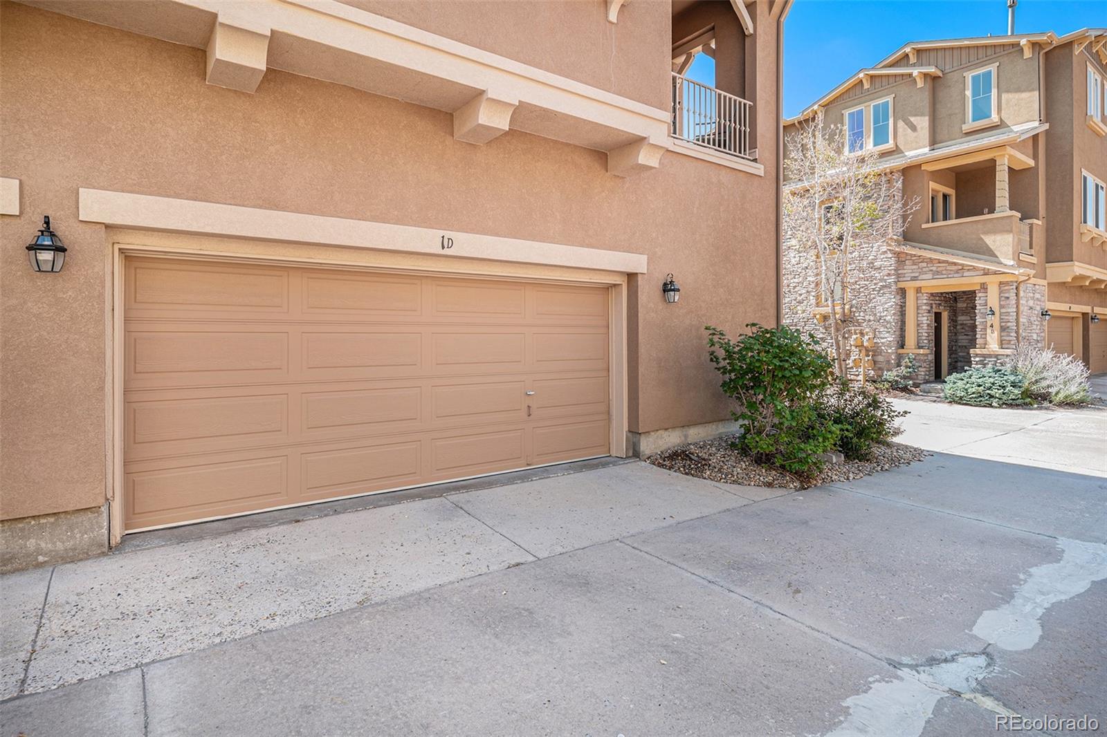 10515 Ashfield Street, Unit 1D Highlands Ranch, CO 80126 - Photo 5 of 39 a view of a parking space in front of a building