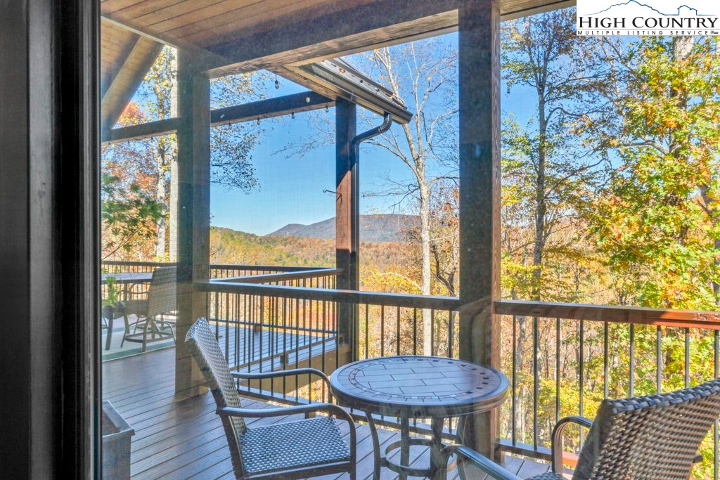 322 South Creek Drive Boone, NC 28607 - Photo 30 of 50 a view of a balcony with furniture and wooden floor
