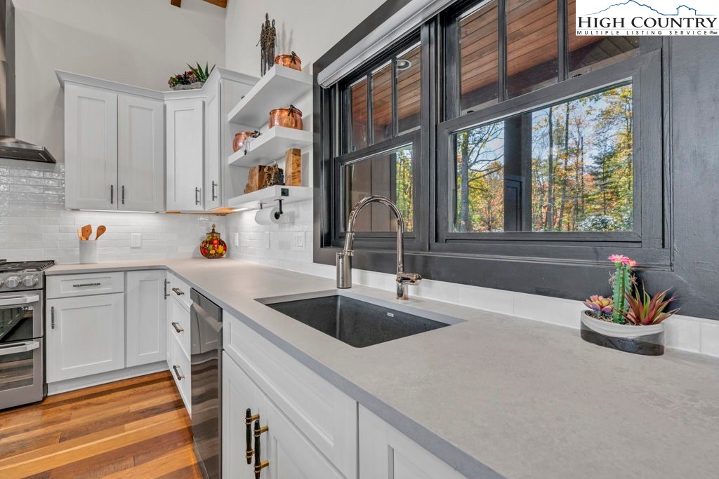 322 South Creek Drive Boone, NC 28607 - Photo 9 of 50 a kitchen with a sink and a window