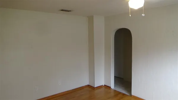 a kitchen with a refrigerator sink and cabinets