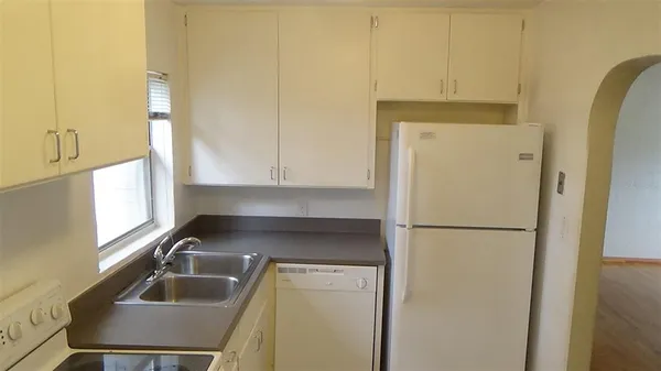 a kitchen with a sink and cabinets