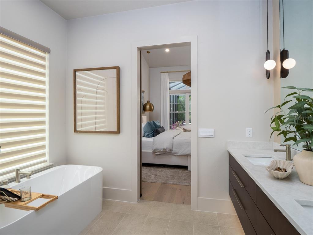 14828 Southwest 9th Lane Newberry, FL 32669 - Photo 24 of 45 a en suite spacious bathroom with a tub double vanity and window
