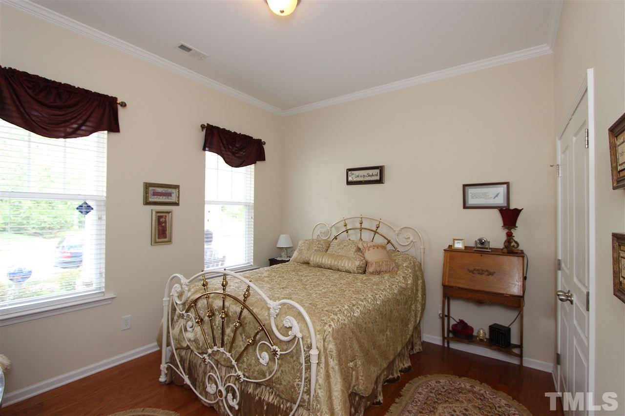 3402 Ranbir Drive Durham, NC 27713 - Photo 14 of 24 a bedroom with a bed and a window