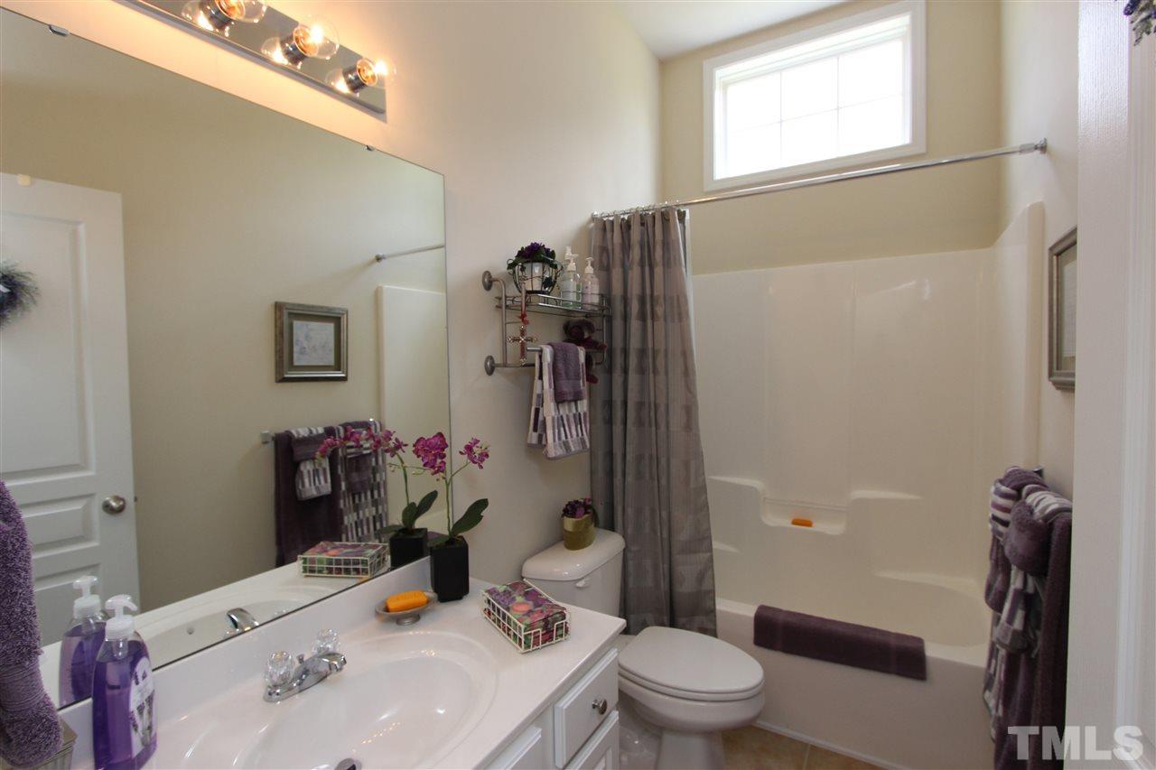 3402 Ranbir Drive Durham, NC 27713 - Photo 15 of 24 a bathroom with a sink toilet and shower