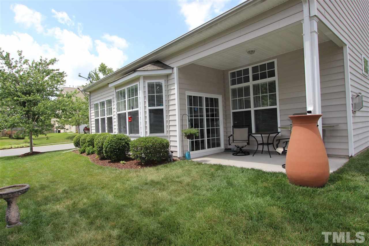 3402 Ranbir Drive Durham, NC 27713 - Photo 21 of 24 a view of a house with backyard sitting area and garden