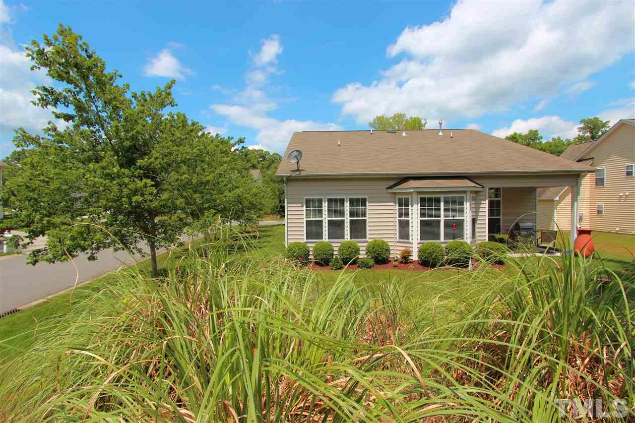 3402 Ranbir Drive Durham, NC 27713 - Photo 22 of 24 a view of a house with a yard