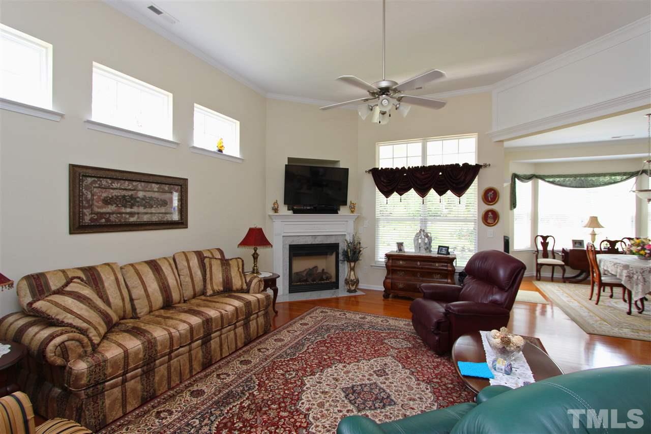 3402 Ranbir Drive Durham, NC 27713 - Photo 6 of 24 a living room with furniture fireplace and flat screen tv