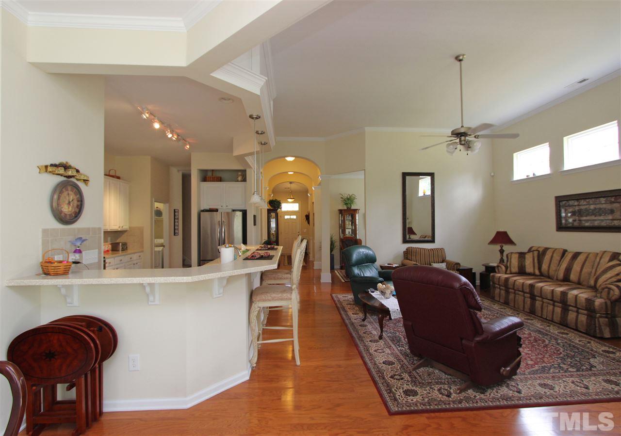 3402 Ranbir Drive Durham, NC 27713 - Photo 7 of 24 a living room with furniture rug and wooden floor