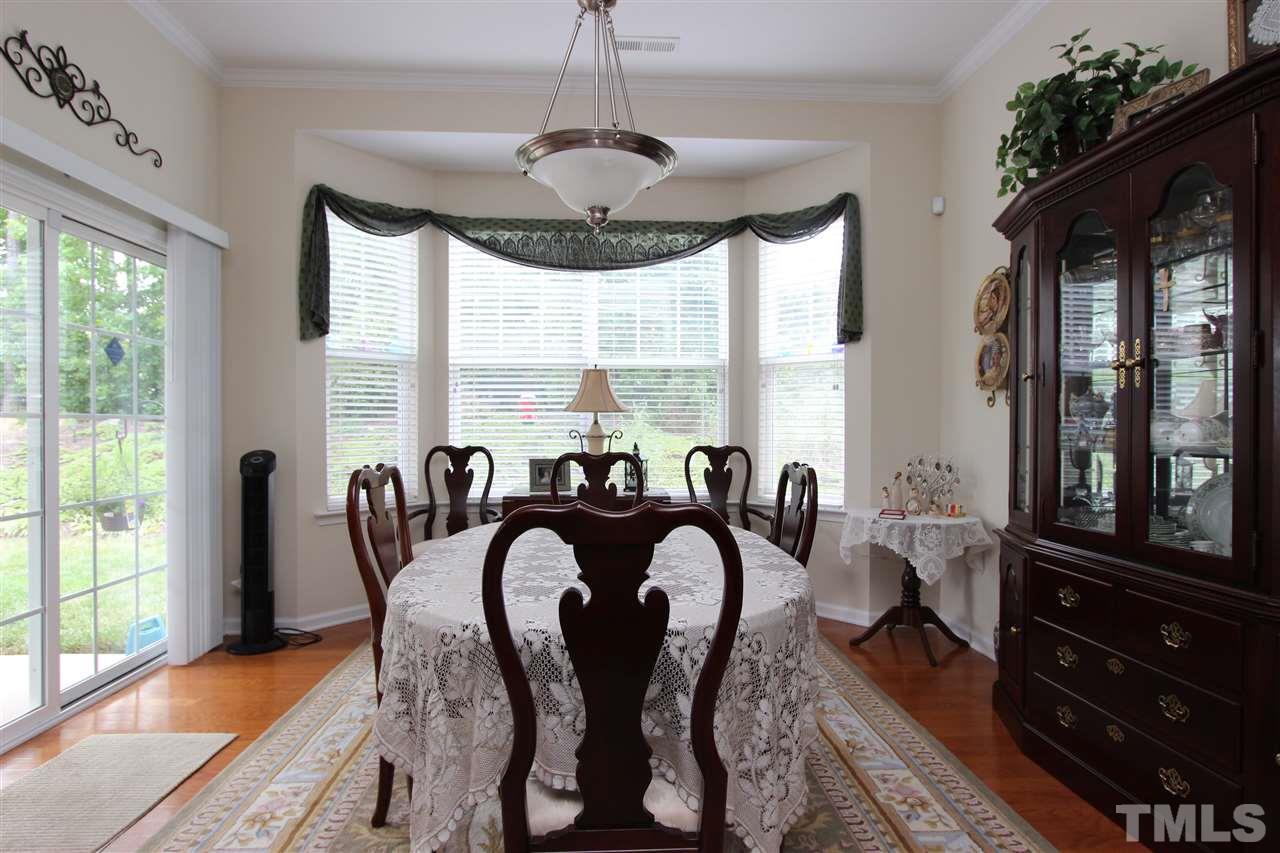3402 Ranbir Drive Durham, NC 27713 - Photo 8 of 24 a view of a dining room with furniture window and outside view