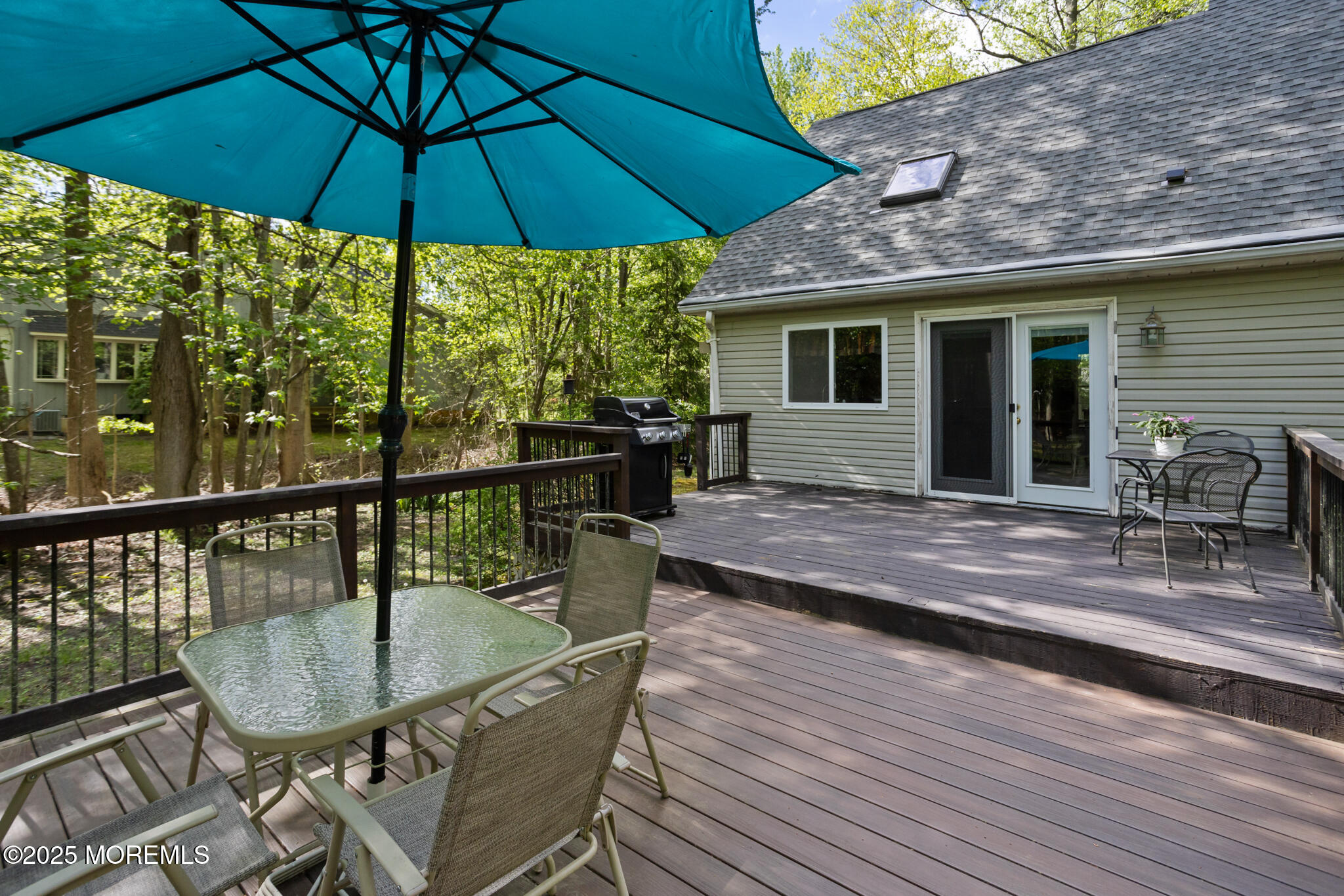 47 East Pleasant Grove Road Jackson, NJ 08527 - Photo 35 of 44 a balcony with table and chairs