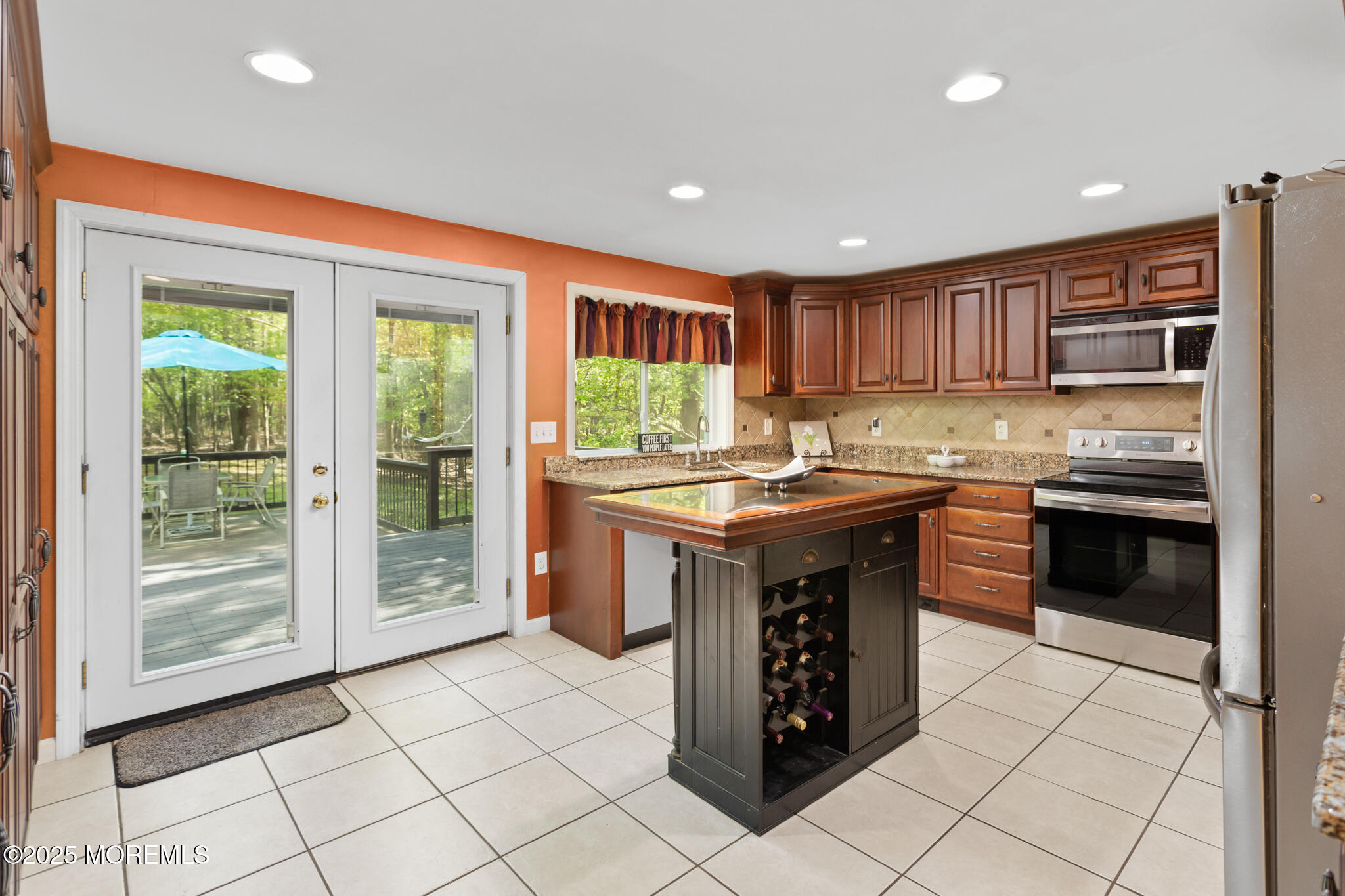 47 East Pleasant Grove Road Jackson, NJ 08527 - Photo 6 of 44 a kitchen with kitchen island granite countertop a stove top oven microwave and cabinets