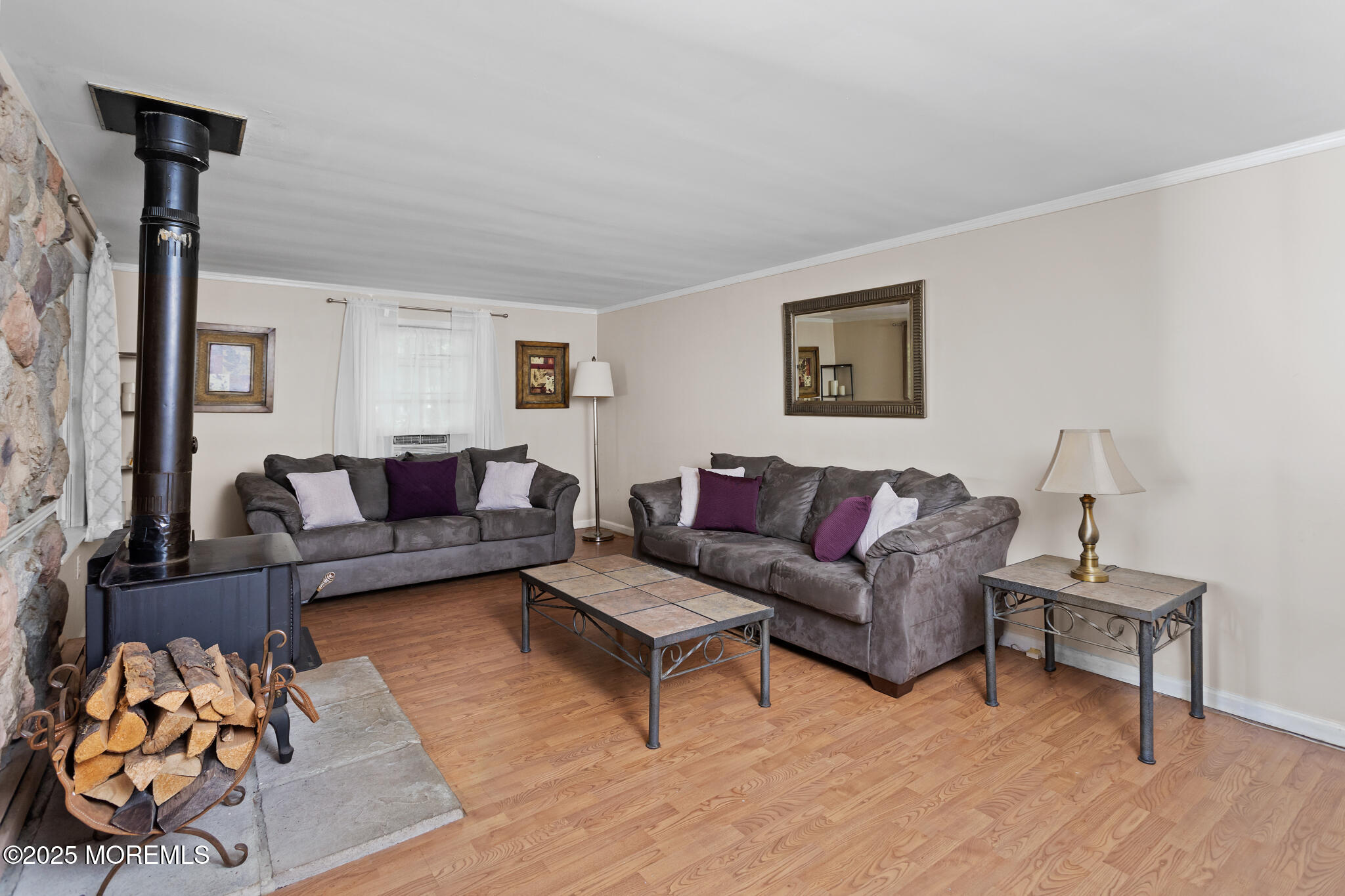 47 East Pleasant Grove Road Jackson, NJ 08527 - Photo 8 of 44 a living room with furniture and a painting on the wall