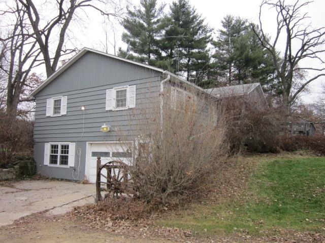 8141 Us Rte 20 West Lena, IL 61048 - Photo 1 of 22 a house that has a tree in front of the house