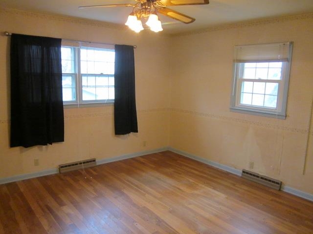 8141 Us Rte 20 West Lena, IL 61048 - Photo 15 of 22 an empty room with wooden floor and windows