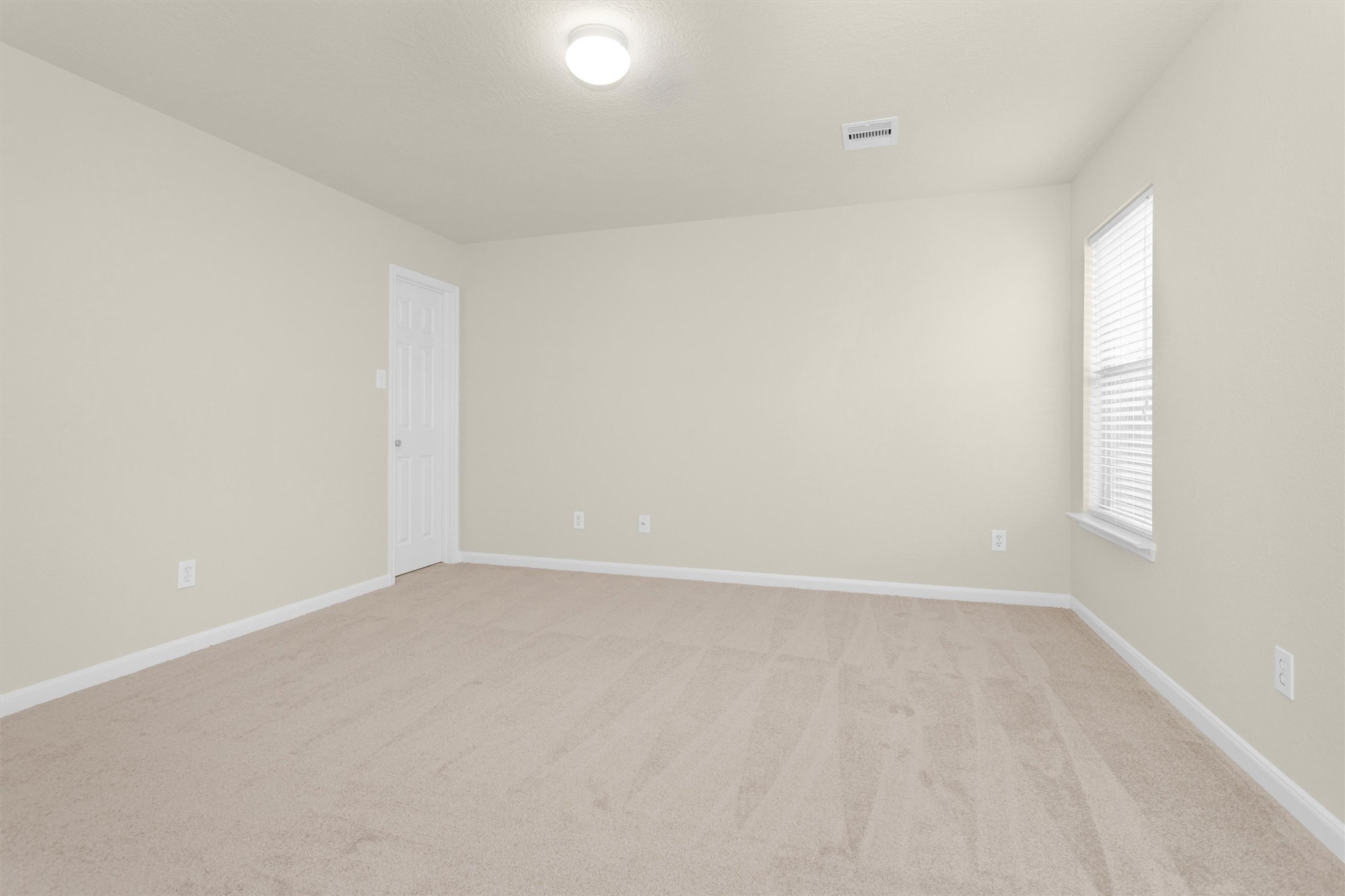3131 Beacon Grove Street Spring, TX 77389 - Photo 18 of 38 a view of an empty room with a window