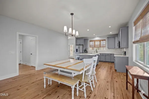 a living room with a fireplace and a flat screen tv