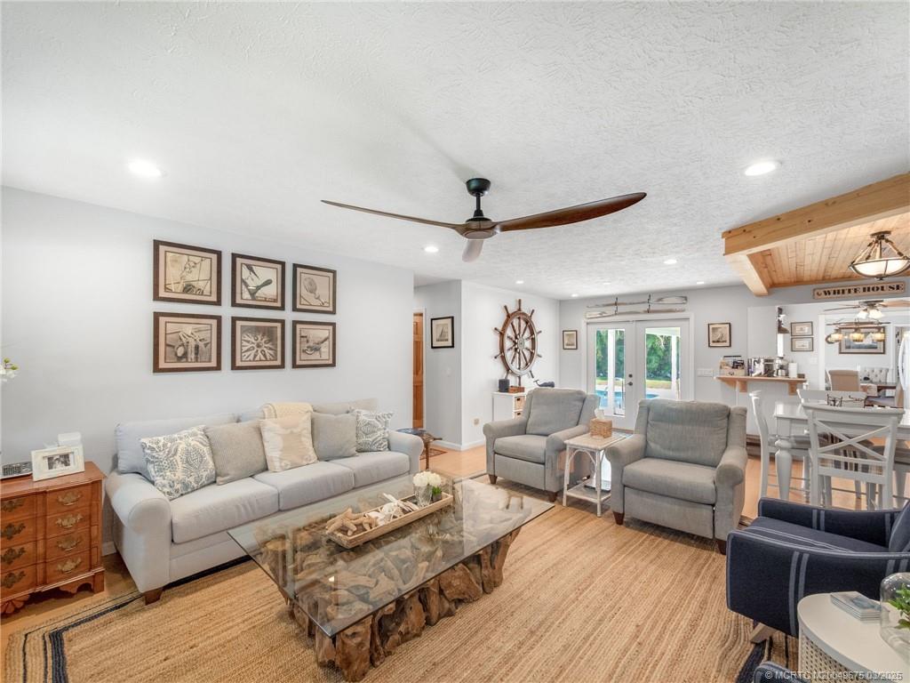1318 Southeast Riverside Drive Stuart, FL 34996 - Photo 14 of 29 a living room with furniture and a wooden floor