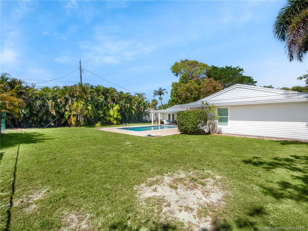 1318 Southeast Riverside Drive Stuart, FL 34996 - Photo 28 of 29 a view of a house with a backyard