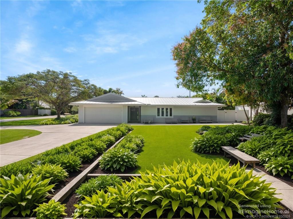 1318 Southeast Riverside Drive Stuart, FL 34996 - Photo 3 of 29 a view of a garden with houses