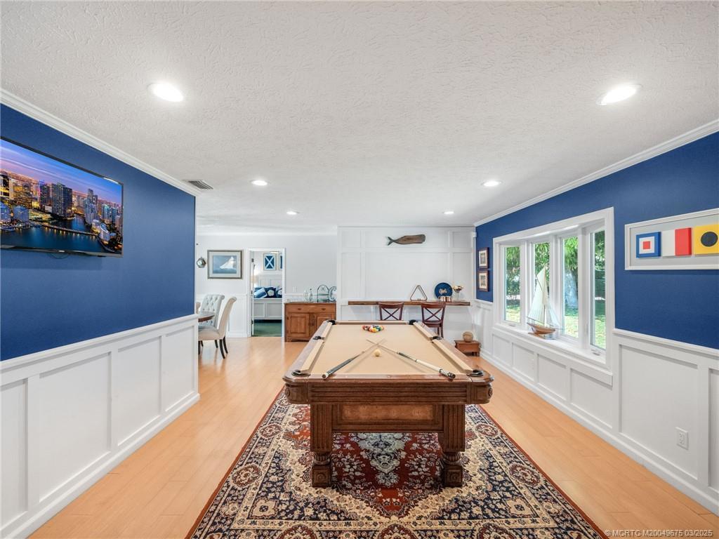 1318 Southeast Riverside Drive Stuart, FL 34996 - Photo 5 of 29 a bed room with furniture and a large window