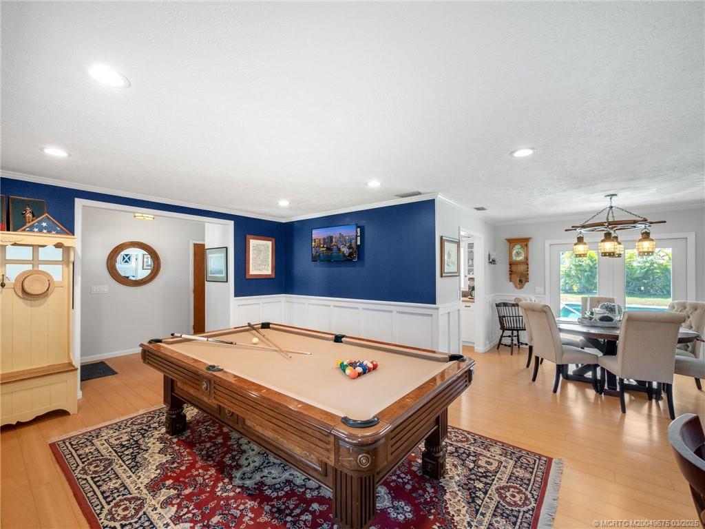1318 Southeast Riverside Drive Stuart, FL 34996 - Photo 7 of 29 a living room with pool table and a table