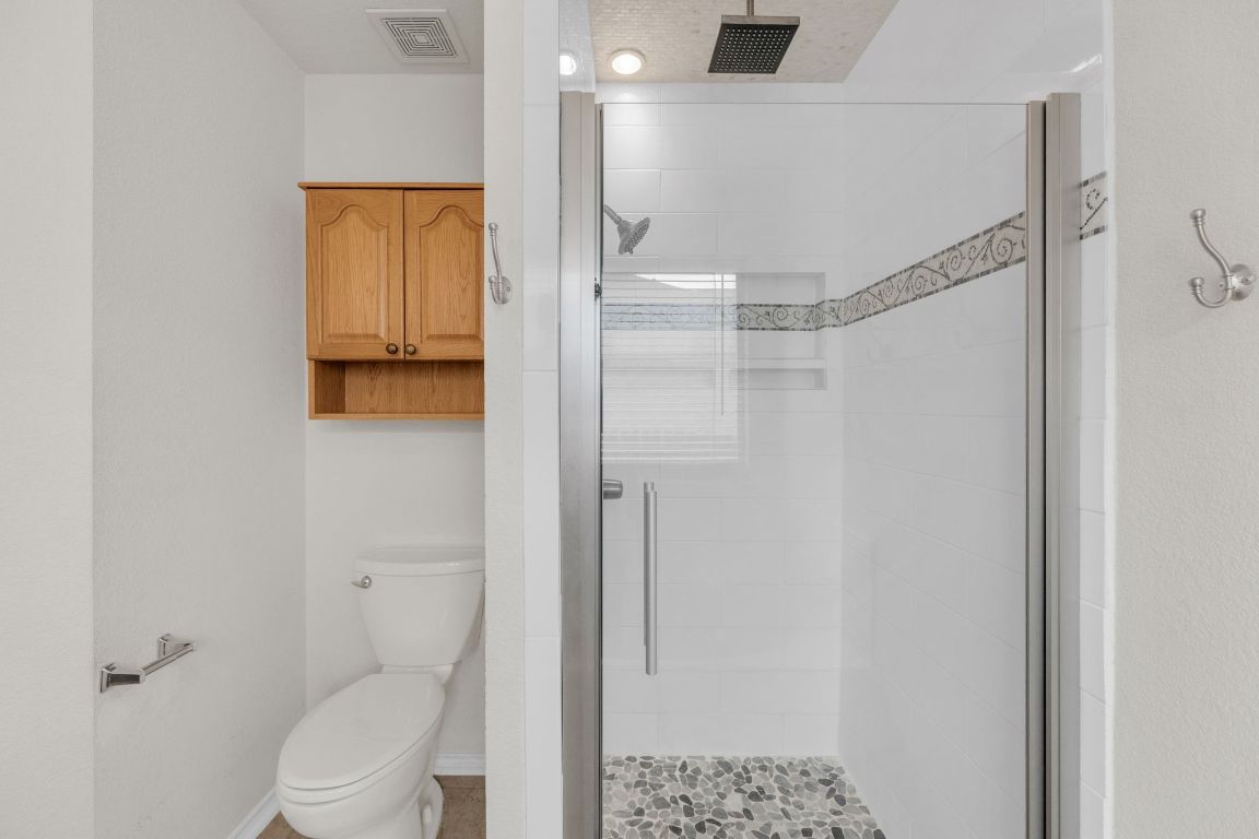 2317 Chestnut Path Round Rock, TX 78664 - Photo 24 of 36 Full bath with a shower stall and toilet