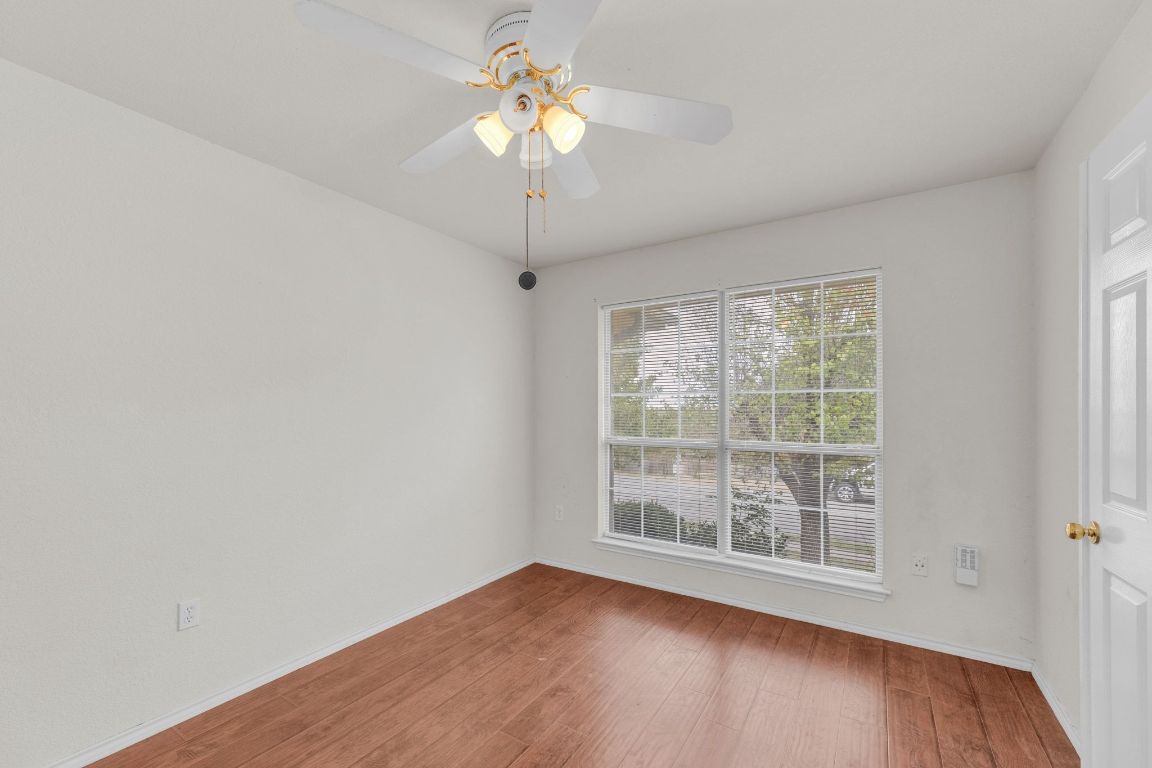 2317 Chestnut Path Round Rock, TX 78664 - Photo 25 of 36 Unfurnished room with wood finished floors and baseboards